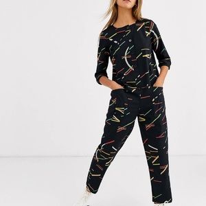 ASOS Design Lounge long sleeved button front jumpsuit in multicoloured geo